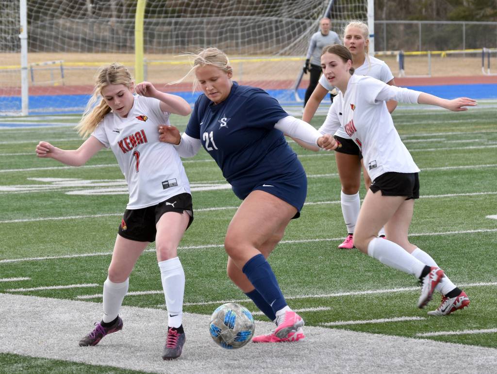 Soldotnas Morgan Lemm tries to turn on Kenai Centrals Tait Cooper on Tuesday, April 23, 2024, at Soldotna High School in Soldotna, Alaska. (Photo by Jeff Helminiak/Peninsula Clarion)