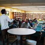 Jonathan Le Shana, Student Success Liaison, greets roughly two dozen representatives of Kenai Peninsula businesses ahead of the start of Career Day at Seward High School in Seward, Alaska, on Wednesday, April 24, 2024. (Jake Dye/Peninsula Clarion)