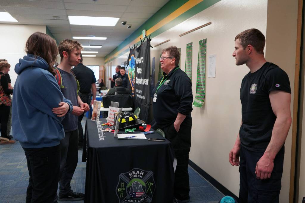 Oliver Trobaugh speaks to representatives of Bear Creek Volunteer Fire Department during Career Day at Seward High School in Seward, Alaska, on Wednesday, April 24, 2024. (Jake Dye/Peninsula Clarion)