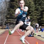 Nikiskis Thayne Quiner won the long jump Saturday, April 27, 2024, at the Kenai Invitational at Kenai Central High School in Kenai, Alaska. (Photo by Jeff Helminiak/Peninsula Clarion)