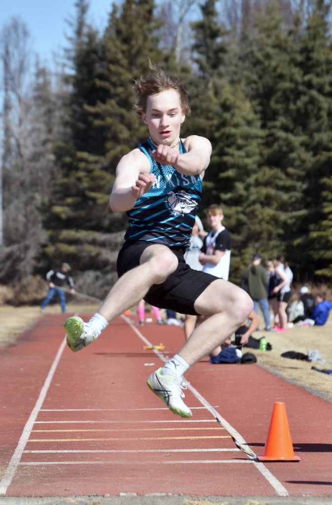Nikiskis Thayne Quiner won the long jump Saturday, April 27, 2024, at the Kenai Invitational at Kenai Central High School in Kenai, Alaska. (Photo by Jeff Helminiak/Peninsula Clarion)