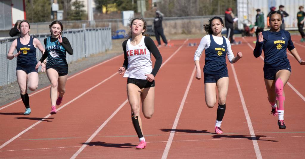 Kenai Centrals Sophie Tapley wins the 100 meters Saturday, April 27, 2024, at the Kenai Invitational at Kenai Central High School in Kenai, Alaska. (Photo by Jeff Helminiak/Peninsula Clarion)