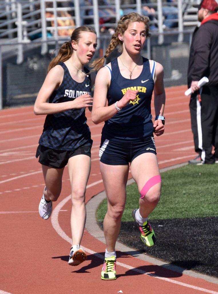 Homers Daisy MossWalker leads Soldotnas Tania Boonstra in the 1,600 meters. Boonstra would pass MossWalker for the victory Saturday, April 27, 2024, at the Kenai Invitational at Kenai Central High School in Kenai, Alaska. (Photo by Jeff Helminiak/Peninsula Clarion)