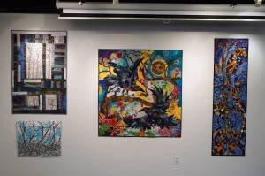 Art by Chelline Larsen and Adam Hoyt, for Stitch, Paint, Fabricate, fills the walls of the Kenai Art Center in Kenai, Alaska, on Wednesday, May 1, 2024. (Jake Dye/Peninsula Clarion)