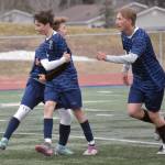 Soldotnas Lane Hillyer (front) celebrates his goal against Ketchikan with teammates Thursday, May 2, 2024, at Soldotna High School in Soldotna, Alaska. (Photo by Jeff Helminiak/Peninsula Clarion)