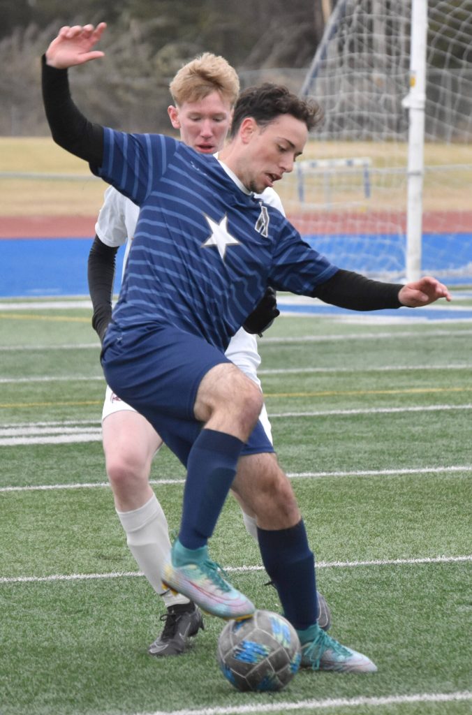 Soldotnas Nuno Venturi dribbles against Ketchikans Soren Evison on Thursday, May 2, 2024, at Soldotna High School in Soldotna, Alaska. (Photo by Jeff Helminiak/Peninsula Clarion)