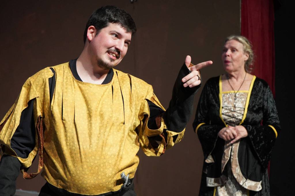 Luke Burgess and Terri Zopf-Schoessler rehearse Murder at the Renaissance Faire at the Kenai Performers Theater in Soldotna, Alaska, on Wednesday, May 8, 2024. (Jake Dye/Peninsula Clarion)