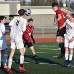 Kenai Centrals Ryker Dykema heads in a corner kick for a goal Thursday, May 9, 2024, at Kenai Central High School in Kenai, Alaska. (Photo by Jeff Helminiak/Peninsula Clarion)