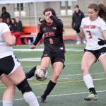 Kenai Centrals Chloe Grimm takes a shot in front of Houstons Bella Russell on Thursday, May 9, 2024, at Kenai Central High School in Kenai, Alaska. (Photo by Jeff Helminiak/Peninsula Clarion)