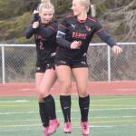Kenai Centrals Brynnen Hanson celebrates her goal with Kate Wisnewski on Thursday, May 9, 2024, at Kenai Central High School in Kenai, Alaska. (Photo by Jeff Helminiak/Peninsula Clarion)