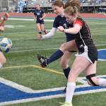 Soldotnas Grayson Henry tries to play through the defense of Houstons Lo Mongolia and Dallas Massie on Friday, May 10, 2024, at Soldotna High School in Soldotna, Alaska. (Photo by Jeff Helminiak/Peninsula Clarion)