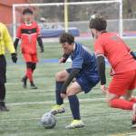Soldotna's Nuno Venturi puts a move on Houston's Parker Bethel on Friday, May 10, 2024, at Soldotna High School in Soldotna, Alaska. (Photo by Jeff Helminiak/Peninsula Clarion)