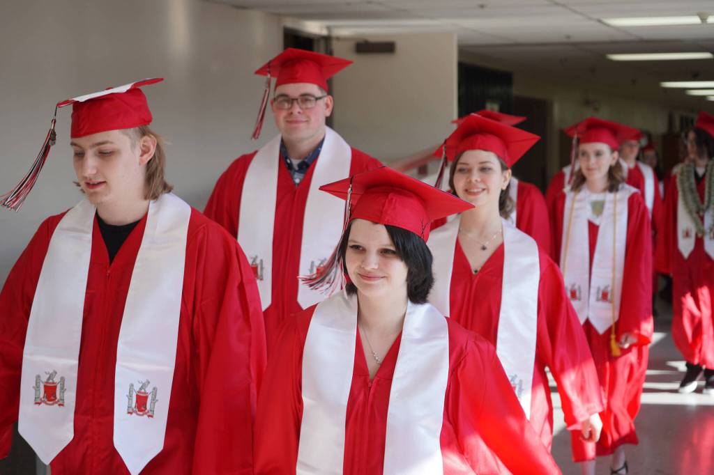 Graduates of Kenai Central High School proceed into the schools auditorium in Kenai, Alaska, on Monday, May 13, 2024. (Jake Dye/Peninsula Clarion)