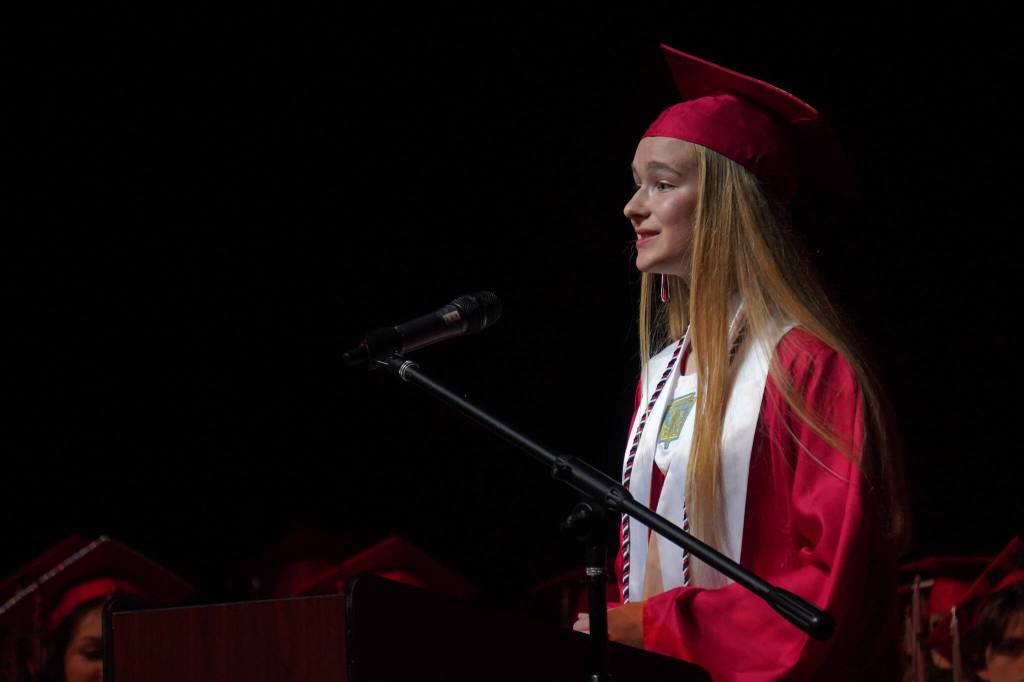 Salutatorian Emily Moss speaks to her fellow students at their graduation ceremony at Kenai Central High School in Kenai, Alaska, on Monday, May 13, 2024. (Jake Dye/Peninsula Clarion)