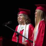 Senior class speakers Ashlyn Potton and Emma Beck deliver a joke while speaking to fellow students of Kenai Central High School at their graduation ceremony in the schools auditorium in Kenai, Alaska, on Monday, May 13, 2024. (Jake Dye/Peninsula Clarion)