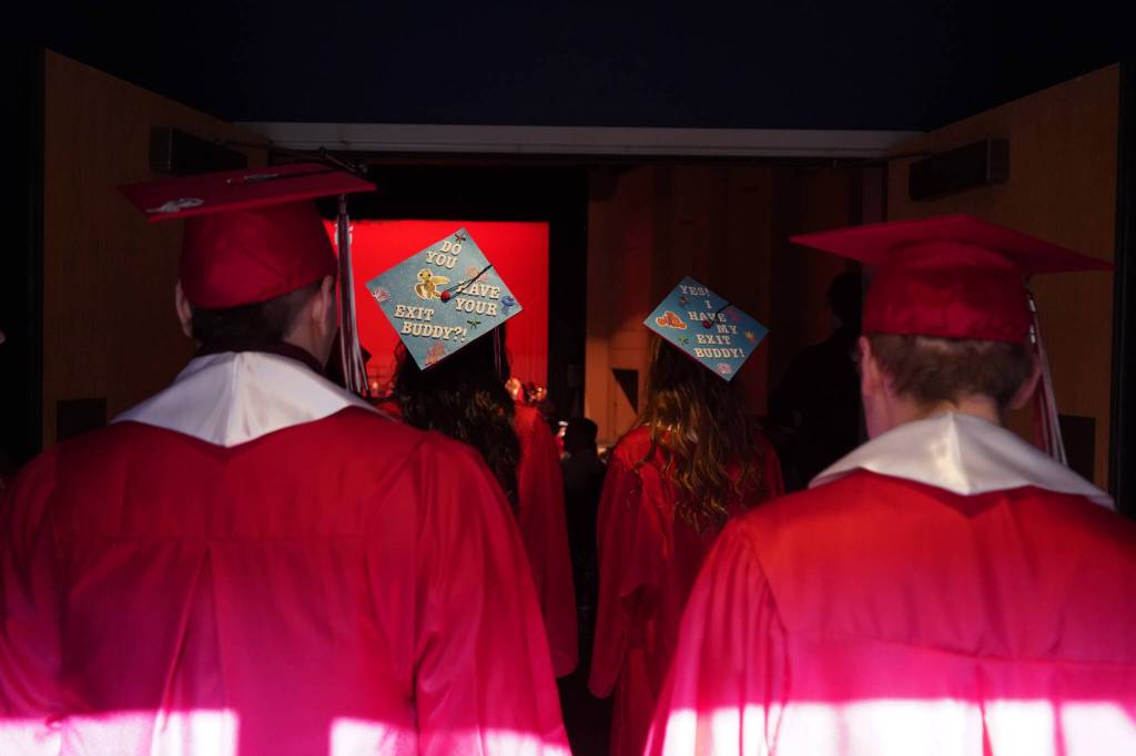 Graduates of Kenai Central High School proceed into the schools auditorium in Kenai, Alaska, on Monday, May 13, 2024. (Jake Dye/Peninsula Clarion)