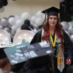 Valedictorian Shelby McGahan rises to speak during a graduation ceremony at Nikiski Middle/High School in Nikiski, Alaska, on Wednesday, May 15, 2024. (Jake Dye/Peninsula Clarion)