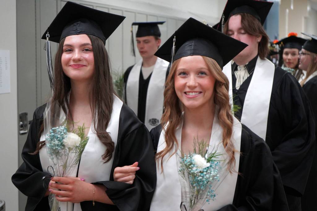 Nikiski Middle/High School graduates proceed into a graduation ceremony in the schools gym in Nikiski, Alaska, on Wednesday, May 15, 2024. (Jake Dye/Peninsula Clarion)