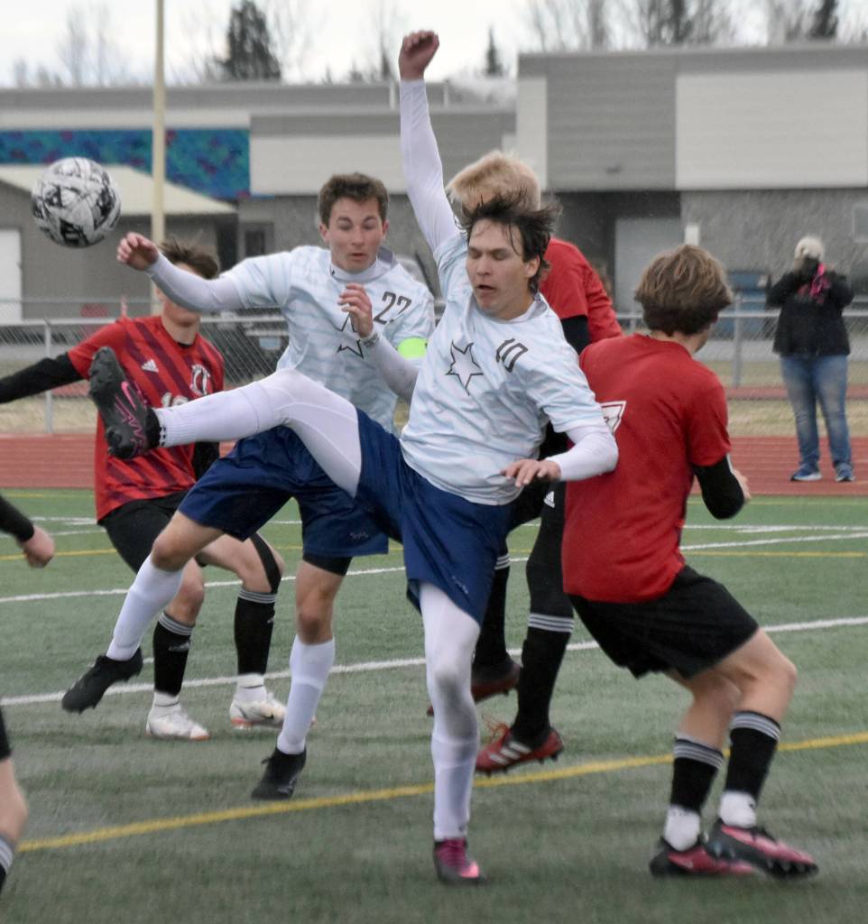 Soldotnas Zac Buckbee and Daniel Heath battle for the ball Saturday, May 18, 2024, at the Peninsula Conference tournament at Kenai Central High School in Kenai, Alaska. (Photo by Jeff Helminiak/Peninsula Clarion)