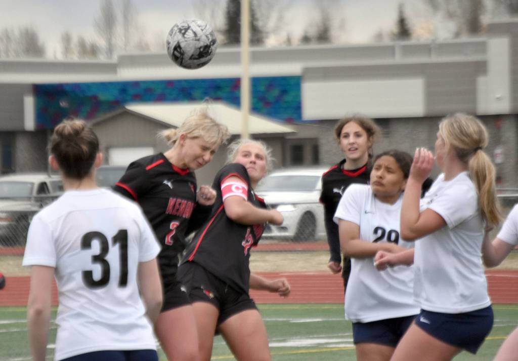 Kenai Centrals Brynnen Hanson and Kate Wisnewski battle for the ball Saturday, May 18, 2024, at the Peninsula Conference tournament at Kenai Central High School in Kenai, Alaska. (Photo by Jeff Helminiak/Peninsula Clarion)