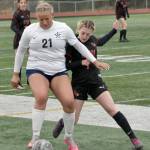 Soldotnas Morgan Lemm shields the ball from Kenai Centrals Tait Cooper on Saturday, May 18, 2024, at the Peninsula Conference tournament at Kenai Central High School in Kenai, Alaska. (Photo by Jeff Helminiak/Peninsula Clarion)