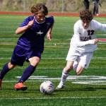 Soldotnas Johnathan Wardas and Juneau-Douglas Ryan Thibodeau battle for the ball during the ASAA Division II Soccer State Championships at Veterans Memorial Field in Wasilla, Alaska, on Saturday, May 25, 2024. (Jake Dye/Peninsula Clarion)