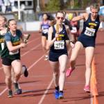 Sewards Juniper Ingalls hand to Hailey Ingalls and Homers Jaela Marchbanks hands to Beatrix McDonough in the 3,200-meter relay at the Division II state track and field meet Saturday, May 25, 2024, at Dimond High School in Anchorage, Alaska. Homer won and Seward was second. (Photo by Jeff Helminiak/Peninsula Clarion)