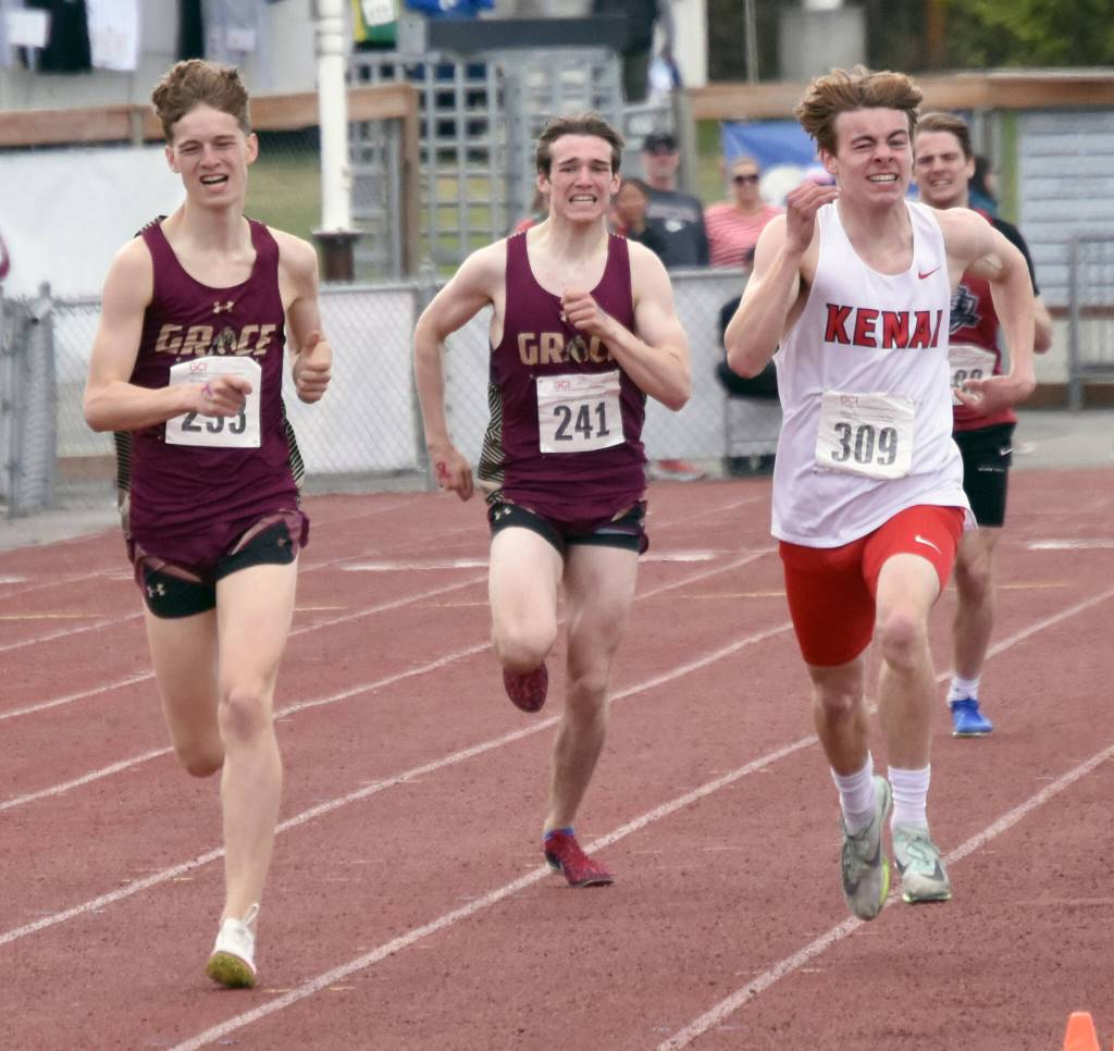 Kenai Centrals Greg Fallon outkicks Grace Christians Robbie Annett and Colten Merriner to the line in the 800 meters at the Division II state track and field meet Saturday, May 25, 2024, at Dimond High School in Anchorage, Alaska. (Photo by Jeff Helminiak/Peninsula Clarion)