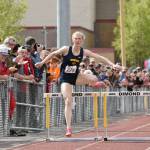Homers Gracie Miotke wins the 300-meter hurdles at the Division II state track and field meet Saturday, May 25, 2024, at Dimond High School in Anchorage, Alaska. (Photo by Jeff Helminiak/Peninsula Clarion)