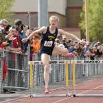 Homer's Gracie Miotke wins the 300-meter hurdles at the Division II state track and field meet Saturday, May 25, 2024, at Dimond High School in Anchorage, Alaska. (Photo by Jeff Helminiak/Peninsula Clarion)