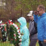 Poppies are affixed to wreaths during a Memorial Day ceremony at Leif Hanson Memorial Park in Kenai on Monday. (Jake Dye/Peninsula Clarion)