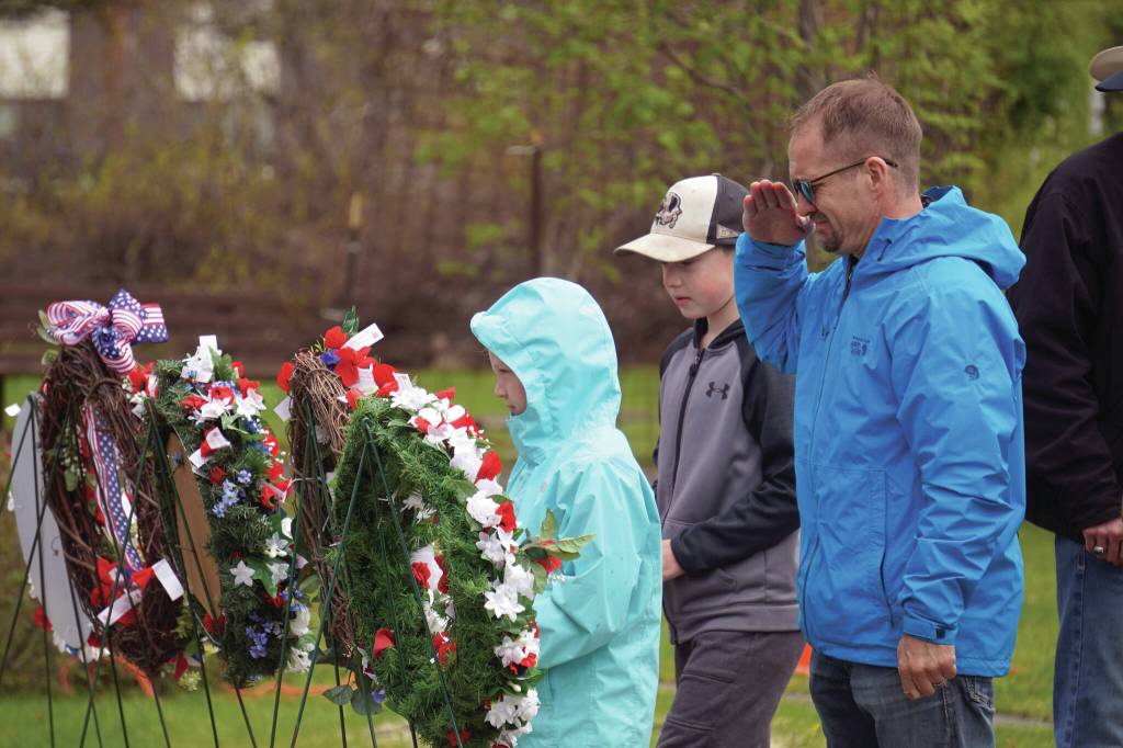 Poppies are affixed to wreaths during a Memorial Day ceremony at Leif Hanson Memorial Park in Kenai on Monday. (Jake Dye/Peninsula Clarion)