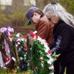 Poppies are affixed to wreaths during a Memorial Day ceremony at Leif Hanson Memorial Park in Kenai, Alaska, on Monday, May 27, 2024. (Jake Dye/Peninsula Clarion)