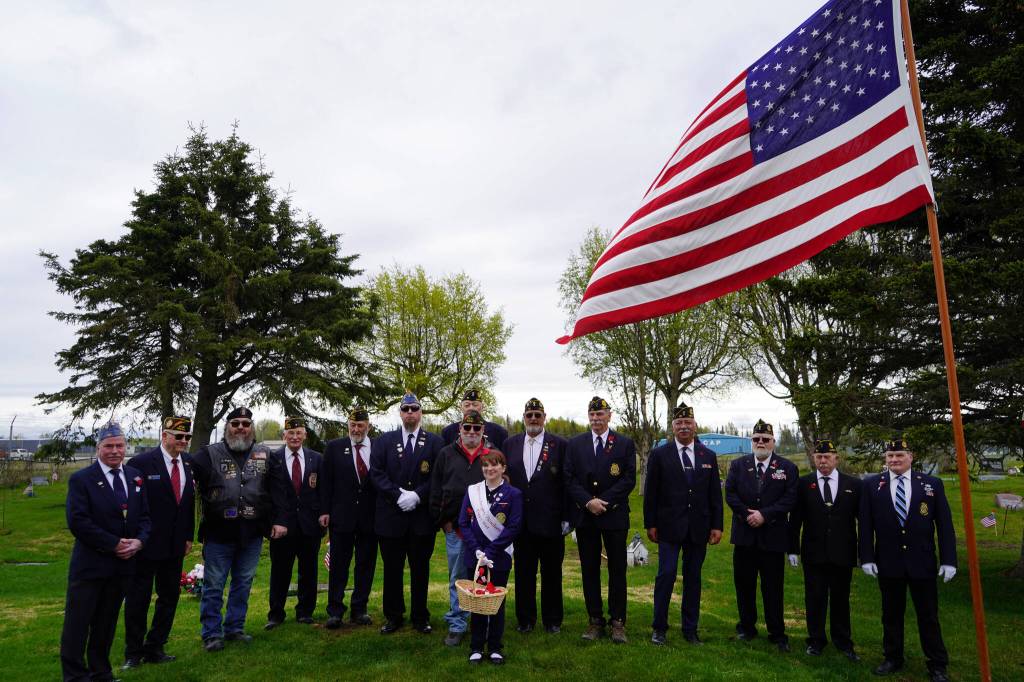 Members of the American Legion Post 20 stand for a photo after a Memorial Day ceremony at the Kenai Cemetery in Kenai, Alaska, on Monday, May 27, 2024. (Jake Dye/Peninsula Clarion)