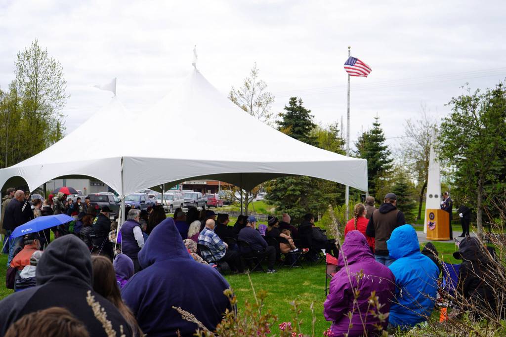 Roughly 100 attendees gather for a Memorial Day ceremony at Leif Hanson Memorial Park in Kenai, Alaska, on Monday, May 27, 2024. (Jake Dye/Peninsula Clarion)