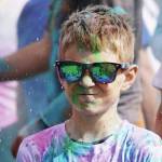 Participants are covered with colored powder during a color run held as part of during the Levitt AMP Soldotna Music Series on Wednesday, June 7, 2023, at the Kenai National Wildlife Refuge Visitors Center in Soldotna (Jake Dye/Peninsula Clarion)