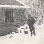 Ira Little poses outside of his recently completed Soldotna homestead cabin in 1947. (Little Family photo courtesy of the Soldotna Historical Society)
