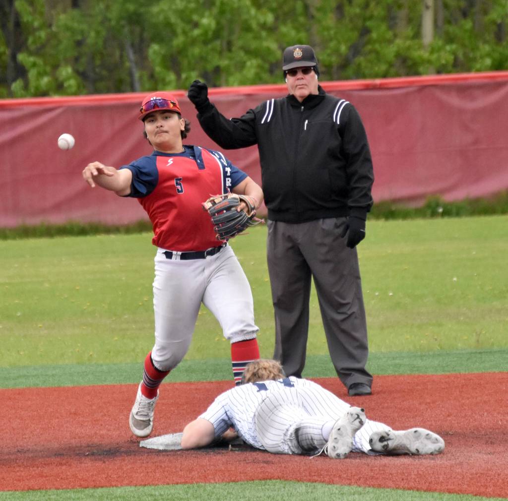 North Poles Pavel Kostov gets the force out on Soldotnas Wyatt Gagnon but is late turning the double play in the Division II state championship game Saturday, June 1, 2024, at Wasilla High School in Wasilla, Alaska. (Photo by Jeff Helminiak/Peninsula Clarion)