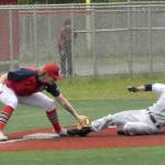 Soldotnas Levi Mickelson slides in safely for a triple in front of North Poles Olan Tucker in the Division II state championship game Saturday, June 1, 2024, at Wasilla High School in Wasilla, Alaska. Mickelson was called safe when the ball popped out of Tuckers glove. (Photo by Jeff Helminiak/Peninsula Clarion)