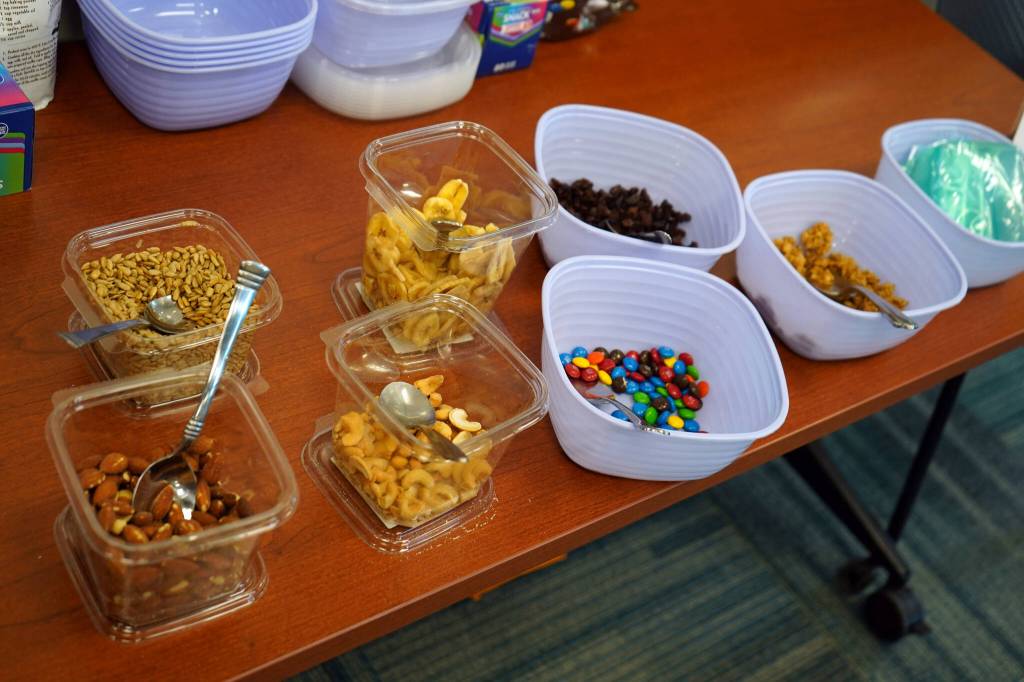 Key ingredients for a trail mix are spread in a Trails and Hiking Discovery Room at the Kenai National Wildlife Refuge Visitors Center near Soldotna, Alaska, on Saturday, June 1, 2024. (Jake Dye/Peninsula Clarion)