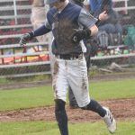 Eagle River's Brooks Inch jogs back to the dugout after getting tagged out on a muddy slide into third base Wednesday, June 5, 2024, at Coral Seymour Memorial Park in Kenai, Alaska. (Photo by Jeff Helminiak/Peninsula Clarion)