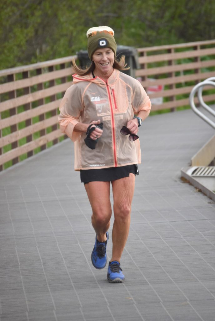 Carloyn Garriott of Bozeman, Montana, runs along the Kenai River at the Tsalteshi Backyard Ultra on Friday, June 8, 2024, in Soldotna, Alaska. (Photo by Jeff Helminiak/Peninsula Clarion)