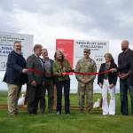 City of Kenai Public Works Director Scott Curtain, City of Kenai Mayor Brian Gabriel, Kenai Peninsula Borough Mayor Peter Micciche, Sen. Lisa Murkowski, Col. Jeffrey Palazzini, Elaina Spraker, Adam Trombley and Kenai City Manager Terry Eubank cut the ribbon to celebrate the start of work on the Kenai River Bluff Stabilization Project on the bluff above the Kenai River in Kenai, Alaska, on Monday, June 10, 2024. (Jake Dye/Peninsula Clarion)