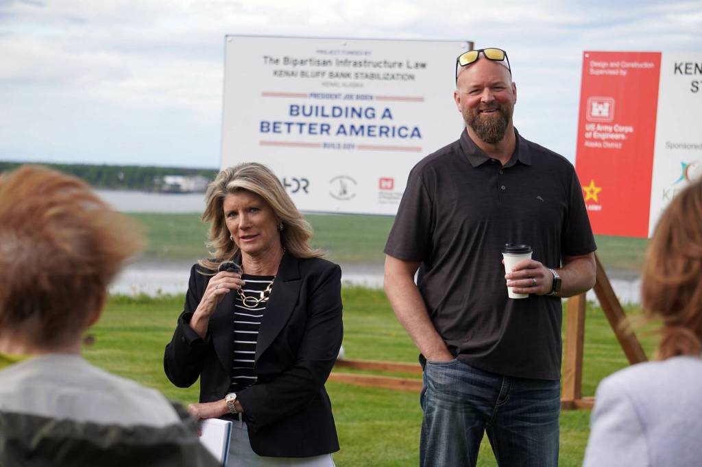 Elaina Spraker and Adam Trombley speak at a ribbon-cutting for the Kenai River Bluff Stabilization Project on the bluff above the Kenai River in Kenai, Alaska, on Monday, June 10, 2024. (Jake Dye/Peninsula Clarion)