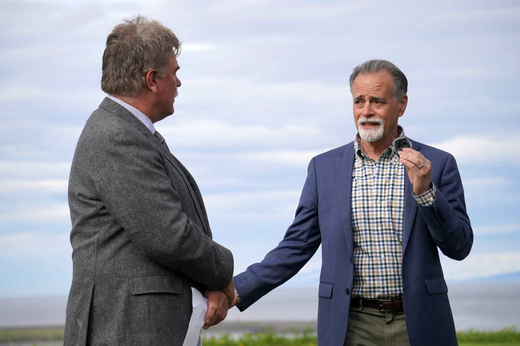 City of Kenai Mayor Brian Gabriel and Kenai Peninsula Borough Mayor Peter Micciche speak at the ribbon-cutting for the Kenai River Bluff Stabilization Project on the bluff above the Kenai River in Kenai, Alaska, on Monday, June 10, 2024. (Jake Dye/Peninsula Clarion)