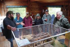 Jake Dye/Peninsula Clarion
Jonathan Wilson leads a tour at the Kbeq Cultural Heritage Interpretive Site near Cooper Landing on Friday.