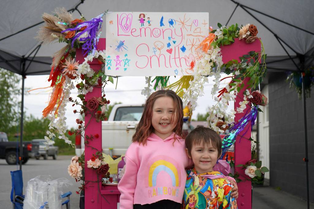 Rylee Smith operates her lemonade stand, Lemony Smiths, outside of Orange Poppy in Soldotna, Alaska, during Lemonade Day on Saturday, June 8, 2024. (Jake Dye/Peninsula Clarion)
