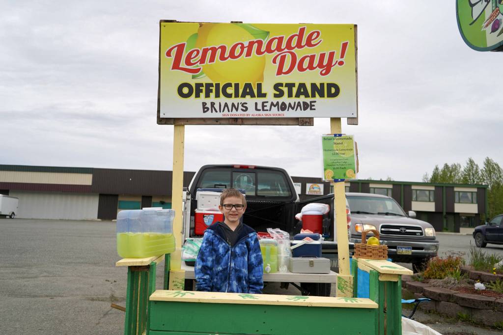 Brian Walker operates his lemonade stand, Brians Lemonade, outside of Kenai Catering in Kenai, Alaska, during Lemonade Day on Saturday, June 8, 2024. (Jake Dye/Peninsula Clarion)