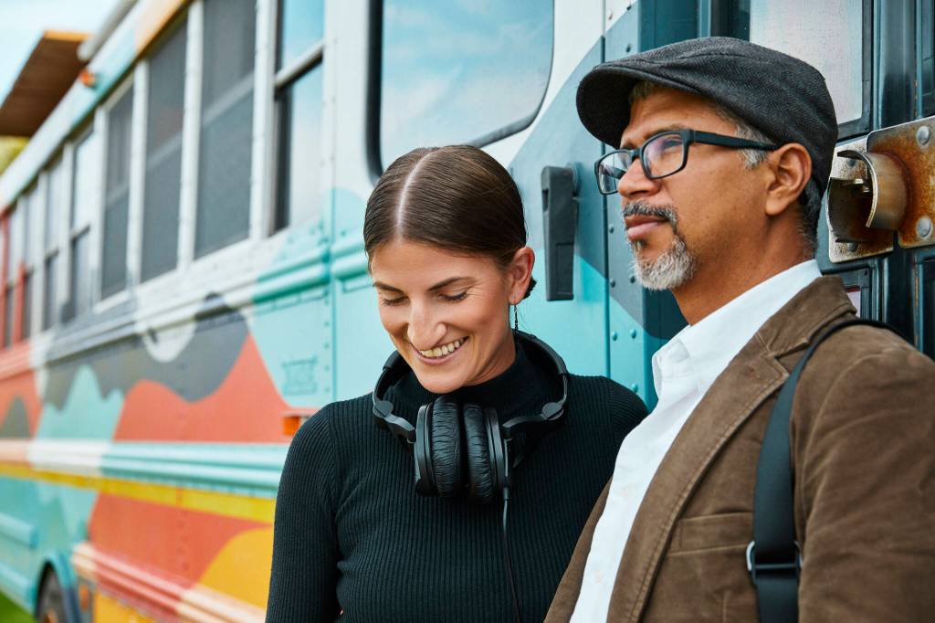 Cora Rose and José Luis Vílchez with their retired school bus-turned-art and recording studio. (Photo provided by Art We There Yet)
