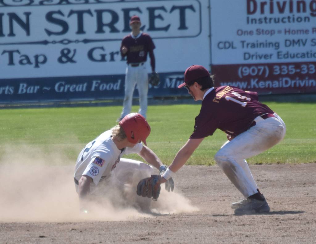 Matthew Schilling of the American Legion Post 20 Twins steals second base against Dimond Lynx Post 21 second baseman Shane Flannery on Saturday, June 15, 2024, at Coral Seymour Memorial Park in Kenai, Alaska. (Photo by Jeff Helminiak/Peninsula Clarion)